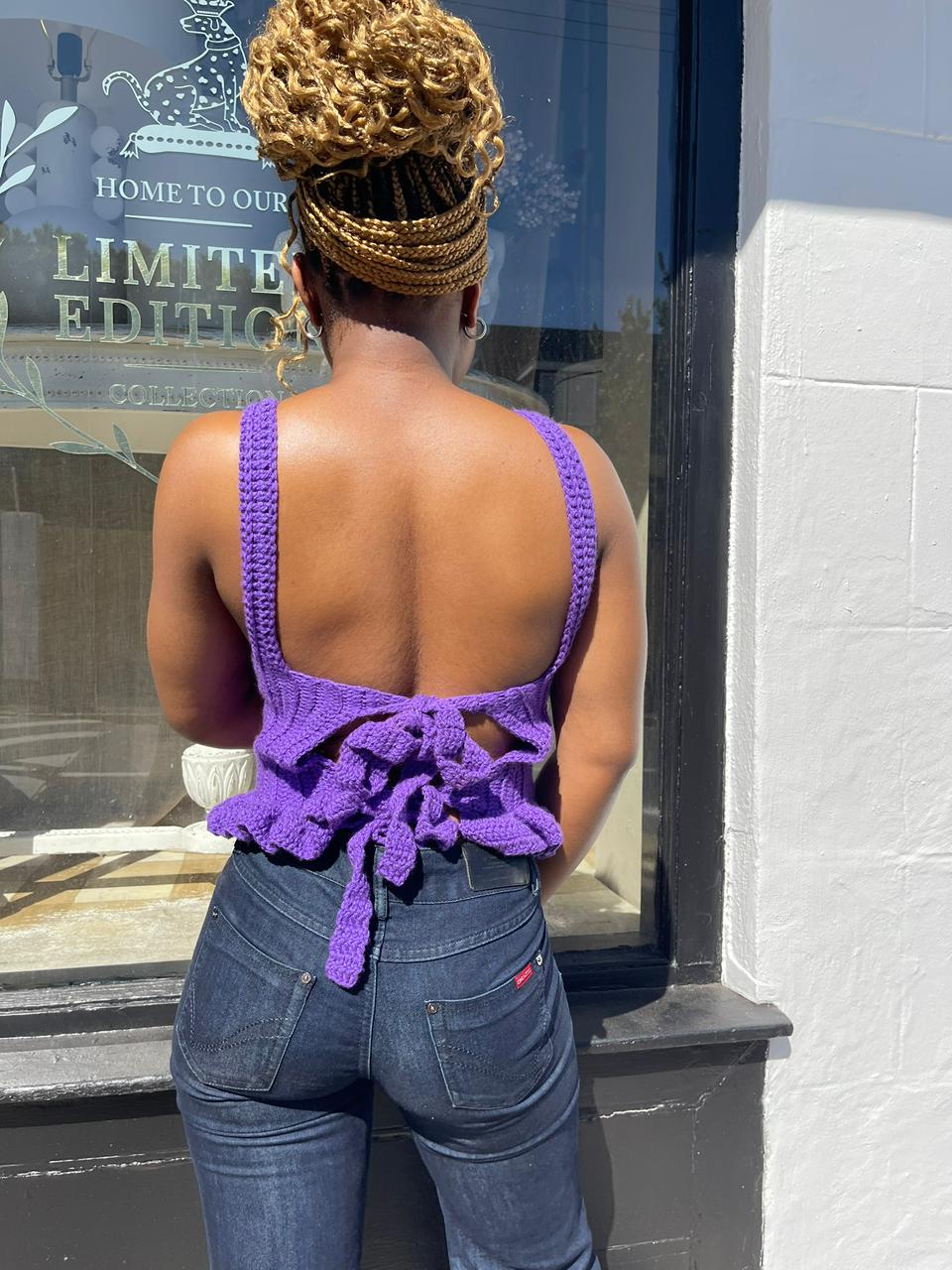 Woman in purple crochet set, back view